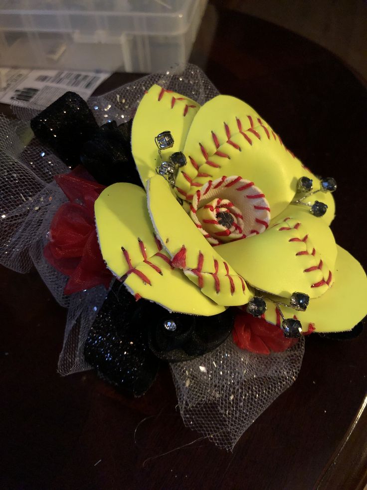 a bouquet of yellow baseballs sitting on top of a table