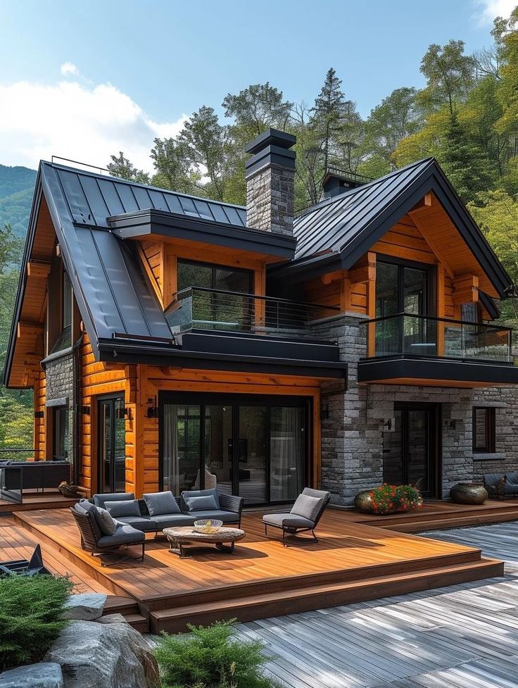 a large wooden house sitting on top of a lush green hillside