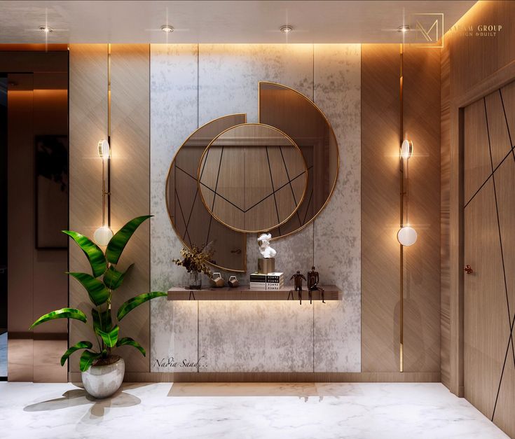 a bathroom with a round mirror on the wall next to a plant in a vase