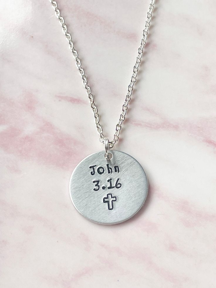 "FEATURES: * The necklace is available with either a silver plated or a sterling silver chain and in various lengths. You can make your selection from the drop down menu. * The aluminium disc measures 25mms (1 inch) in diameter and is hand stamped with John 3.16 and a cross symbol. * John 3.16 - \"For God so loved the world, that he gave his only begotten Son, that whosoever believeth in him should not perish, but have everlasting life.\" * Comes packaged on card inside a clear cello sleeve in a Customizable Inspirational Silver Jewelry, Inspirational Customizable Silver Jewelry, Inspirational Nickel-free Silver Necklace, Customizable Inspirational Sterling Silver Jewelry, Inspirational Silver Adjustable Necklace, Inspirational Silver Jewelry For Birthday, Inspirational Silver Necklace For Father's Day, Inspirational Silver Jewelry For Father's Day, Inspirational Silver Jewelry For Memorials