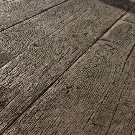 an old wooden floor with some dirt on it