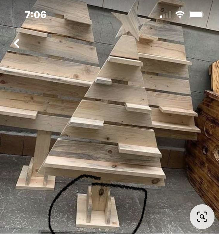 a wooden christmas tree made out of pallets