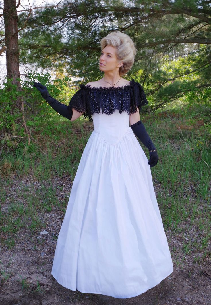 Be the center of attention at your next event donning this striking Victorian styled gown! Beautiful gown has a fitted slightly dropped waist bodice with a V-shaped waistline in the center front and back.  Truly flattering! Corded lace is ruffled around the shoulder and neckline. Full skirt is gathered at the waist. Dry clean.  Poly dupioni.  Designed and made proudly by Recollections in America! The following are approximate finished measurements and include room for ease of movement.  BustWais Victorian Ball, 19th Century Fashion, Tvd Originals, Corded Lace, Beautiful Gowns, Dress Clothes For Women, Full Skirt, V Shape, Ball Gown