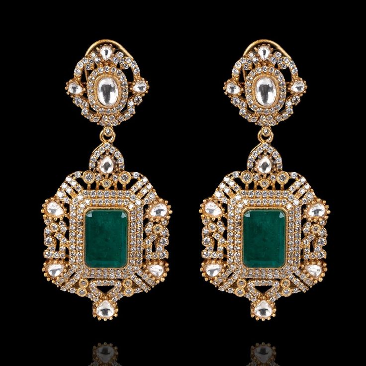 Indulge in luxury, embrace elegance and experience the allure of Kanwal Set - where every piece tells a story of timeless beauty and unparalleled craftsmanship! Dazzle and delight with every step wearing our breathtaking jewelry set featuring a mesmerizing combination of CZ stones with its unparalleled brilliance, polished emeralds evoking the lush beauty of a verdant paradise, and exquisite jadau kundan stones. The set includes a choker and a pair of beautiful earrings. Approximate length of th Elegant Hand-set Crystal Earrings, Luxury Diamond White Jewelry For Formal Occasions, Exquisite Bridal Earrings With Sparkling Stones, Elegant Hand Set Diamond White Bridal Earrings, Luxury Cubic Zirconia Bridal Earrings With Elegant Design, Elegant Hand-set Diamond Earrings, Luxury Gemstone Bridal Earrings For Formal Occasion, Opulent Gemstone Jewelry For Anniversary, Opulent Silver Earrings For Wedding