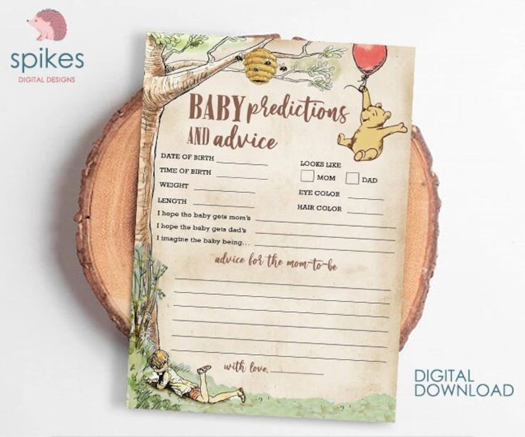 a baby dedication card with winnie the pooh on it is sitting next to a piece of wood