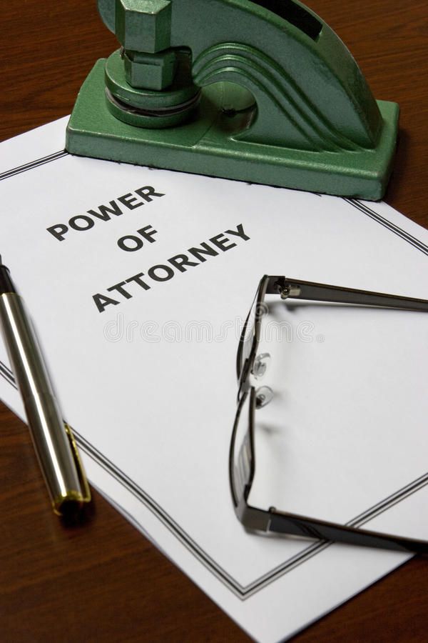 power of attorney on top of paperwork with eyeglasses and pen royalty images, stock photos