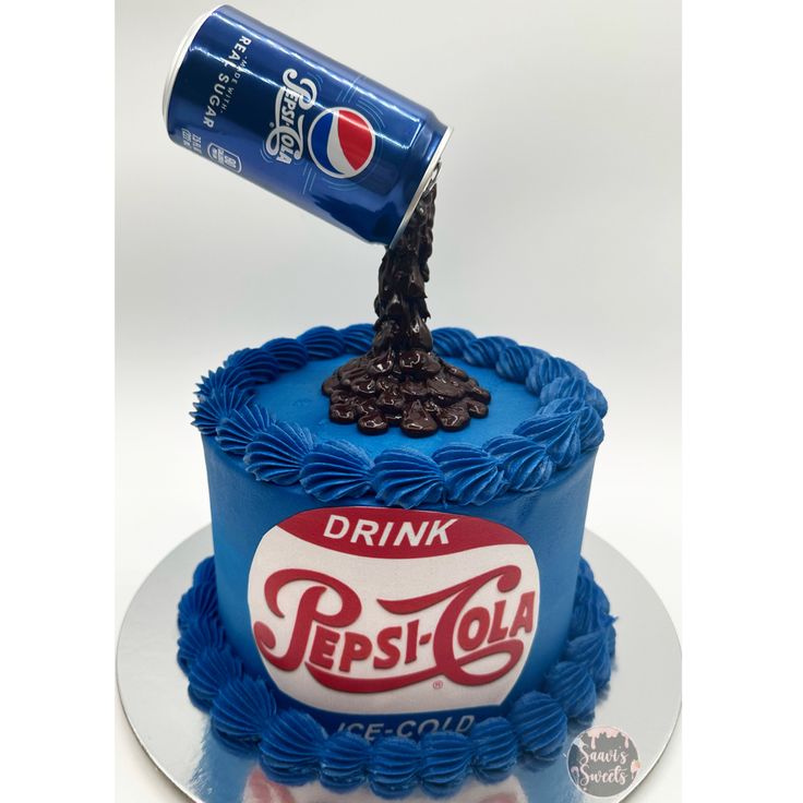 a birthday cake with a pepsi can on top and an ice cold drink in the middle