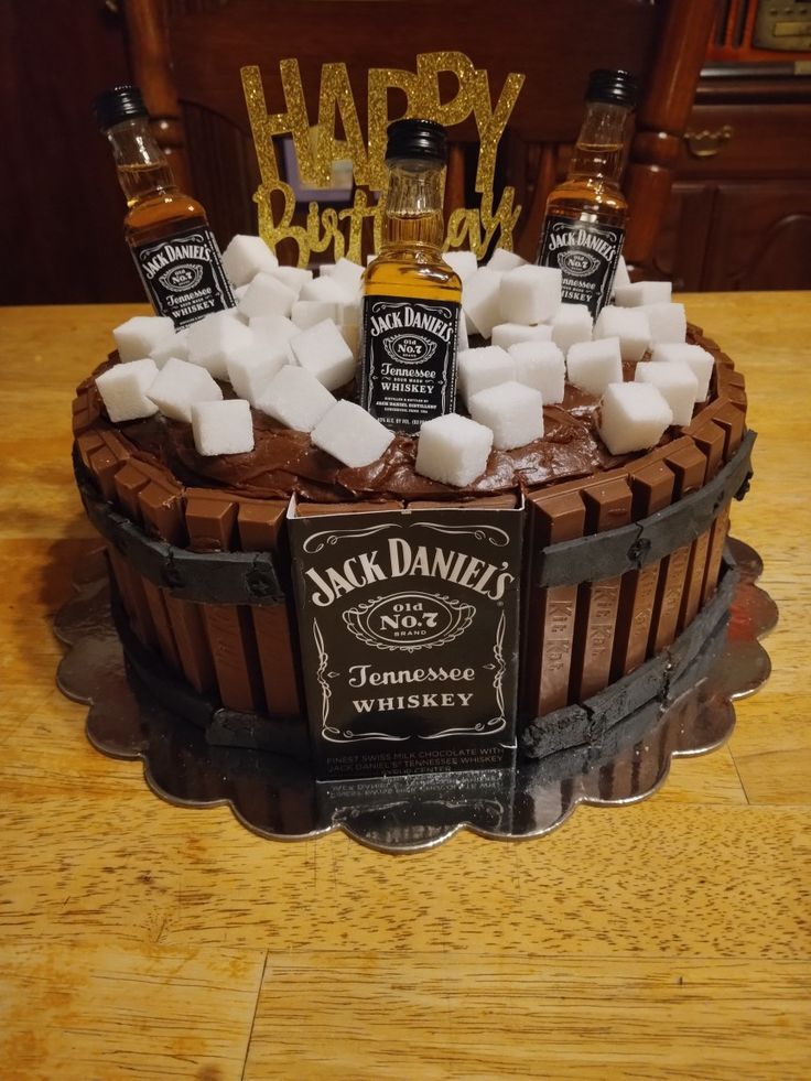 a birthday cake made to look like a barrel with marshmallows on top