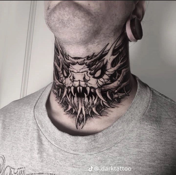 a man's neck with a tattoo on it