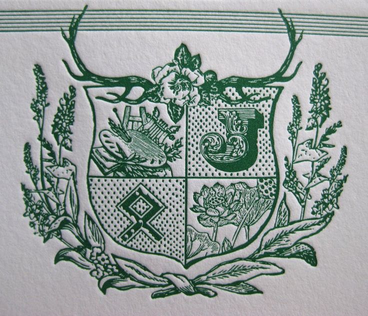 a coat of arms with flowers and deer heads on the crest is shown in green ink