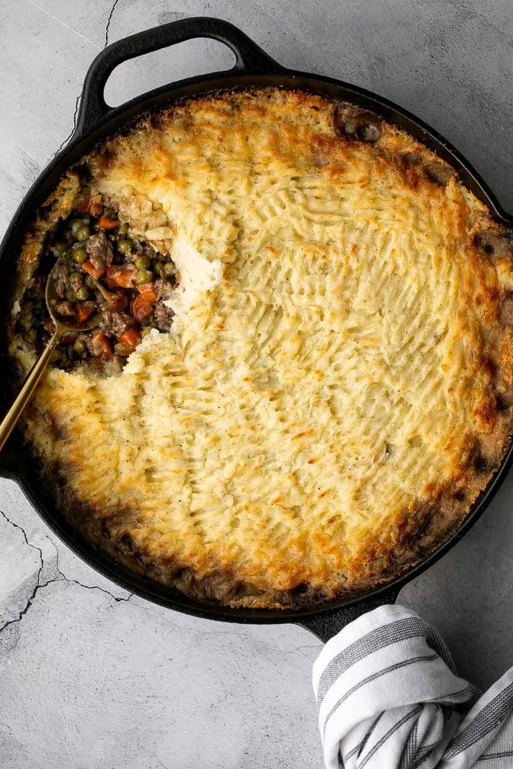 a pot pie with a serving spoon in it