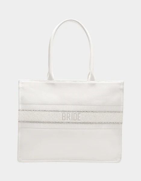 BRIDE TOTE WHITE Canvas Bag | Bridal Tote Bags – Betsey Johnson Chic Wedding Tote Shoulder Bag, Chic Tote Shoulder Bag For Wedding, White Tote Shoulder Bag For Wedding, White Canvas Bag With Dust Bag, Wedding Gift Bag Tote, White Shoulder Bag For Wedding Gift, Chic White Wedding Bags, Chic White Wedding Bag, Wedding Gift Tote Bag