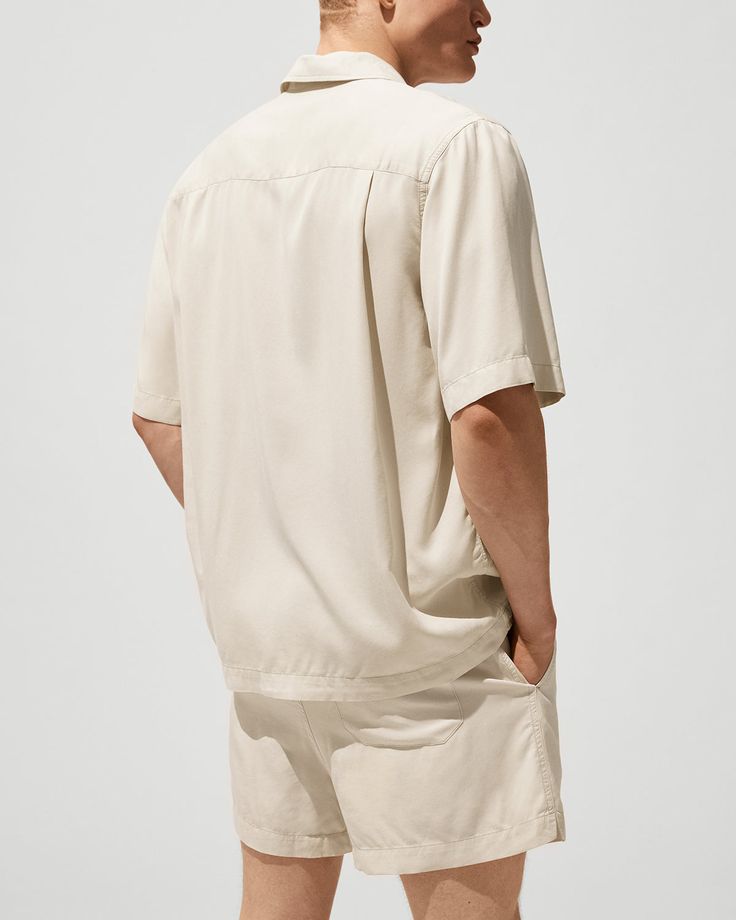 Our garment dyed, twill-weave Pool Shirt is designed with a relaxed and boxy fit, straight hem, and camp collar. Made of Tencel™ lyocell—fibres derived from certified renewable wood sources—providing breathability and a rich drape. Relaxed, boxy fit Camp collar Straight hem Four-button front closure Chest patch pocket Fits true to size Style ID: MSW013112101-1500 100% Tencel™ lyocellMade in Portugal Effortless Shirt With Relaxed Fit And Spread Collar, Effortless Relaxed Fit Shirt With Spread Collar, Effortless Relaxed Fit Shirt With Pockets, Solid Color Relaxed Fit Camp Shirt For Spring, Solid Relaxed Fit Shirt With Camp Collar, Casual Relaxed Fit Tencel Shirt, Solid Shirt With Relaxed Fit And Camp Collar, Relaxed Fit Camp Collar Tops, Solid Color Relaxed Fit Top With Camp Collar