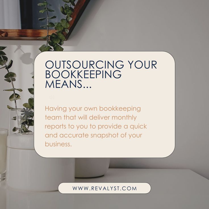 a white vase filled with flowers next to a window sill and a sign that says outsourcing your bookkeeping means having your own bookeeing team