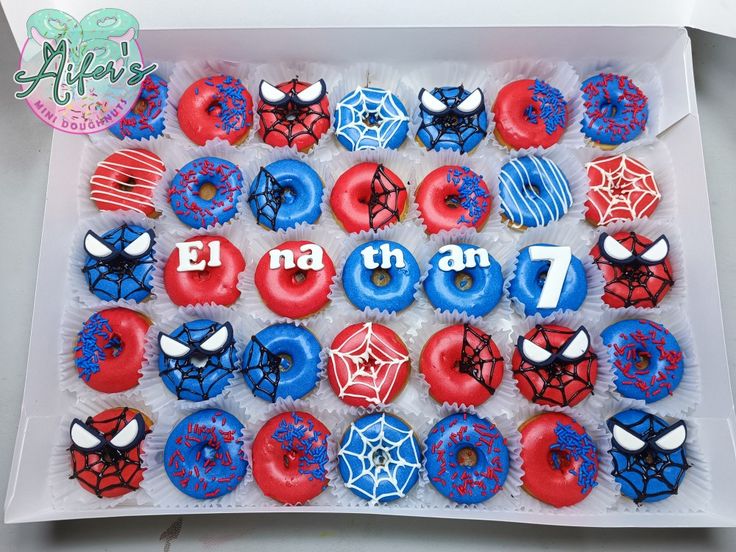 a box filled with red, white and blue cupcakes