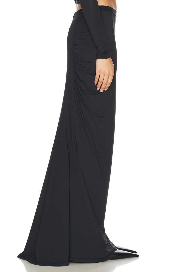 80% nylon 20% lycra.  Made in China.  Machine wash.  Unlined.  Pull-on styling with elastic waistband.  Jersey fabric with ruching detail.  .  .  .  .  .  .  .  .  .  . Ruched Maxi Skirt For Formal Occasions, Elegant Draped Bottoms With Ruched Sides, Elegant Draped Skirt With Ruched Sides, Ruched Fitted Draped Maxi Skirt, Fitted Ruched Draped Maxi Skirt, Ruched Draped Long Skirt For Formal Occasions, Formal Ruched Draped Flowy Skirt, Formal Long Draped Ruched Skirt, Formal Ruched Long Draped Skirt