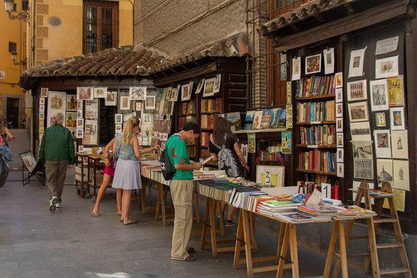 people browse books at an outdoor book market