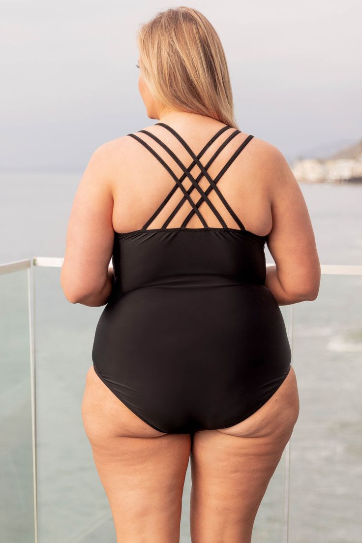 Throw on this fab swimmie and meet us at the lake! This cutie has an always fashionable black color and three strand straps that cross over in the back for a super chic look! The slightly ruched sides are so stylish and the one piece style is so flattering! Style it with a cute kimono for an amazing swim look! 82% Polyamide, 18% Elasthane Black Strappy Swimwear For Poolside, Cross-tied Strappy Back Swimwear For Poolside, Cross-tied Swimwear With Strappy Back For Poolside, Crisscross Lined Swimwear For The Pool, Crisscross Lined Swimwear For Pool, Black Strappy Lined Swimwear, Black Strappy Swimwear For Sunbathing, Strappy Back Tankini With Crisscross Straps For Pool, Strappy Crisscross Tankini For Pool