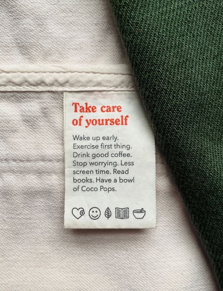 a label on the back of a white shirt that says take care of your self