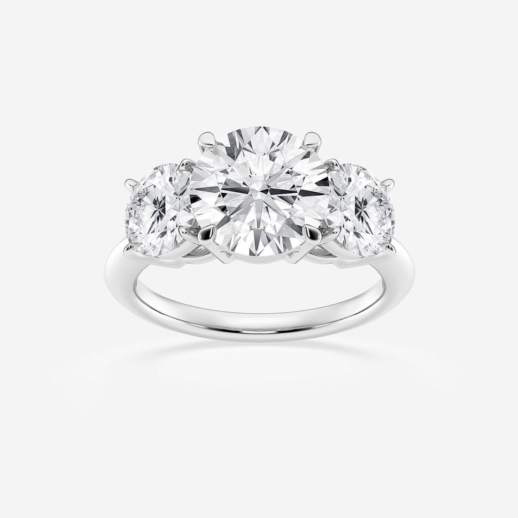 three stone engagement ring with diamonds on top