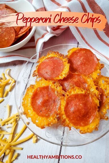 some food is on a glass plate next to yellow pasta noodles and a bowl full of hotdogs