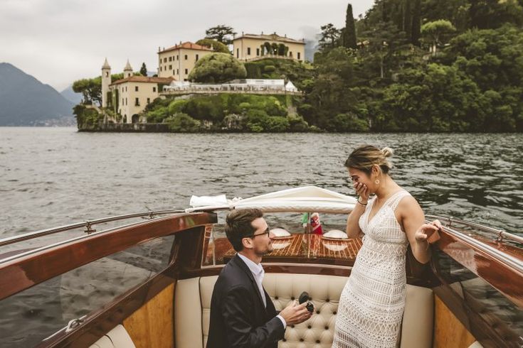 a man and woman on a boat in the water