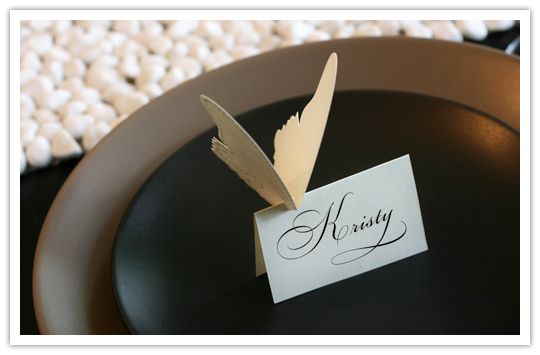 a black plate with a place card on it