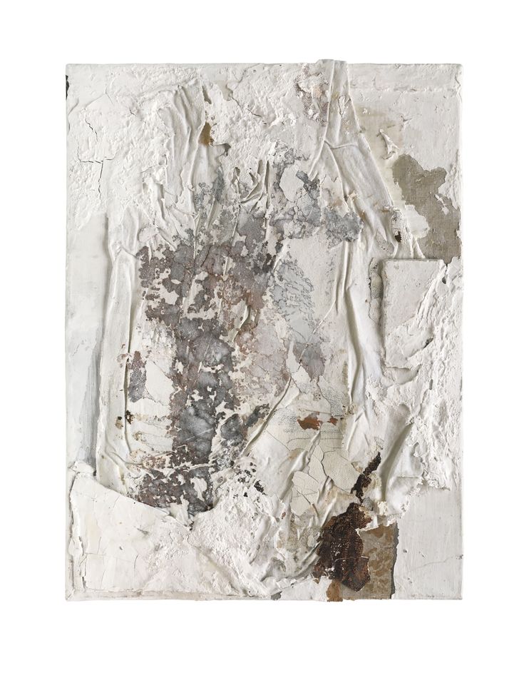 an abstract piece of paper with white and brown paint on the edges, including some torn up