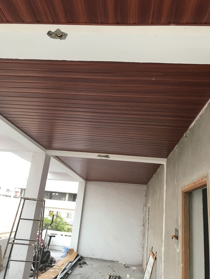 the inside of a building under construction with scaffolding and wood planks on the ceiling