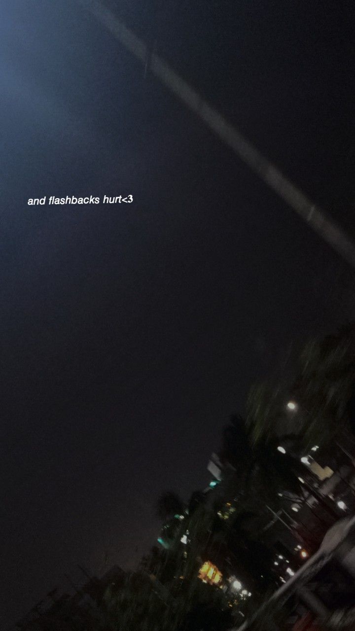 an airplane is flying in the sky at night