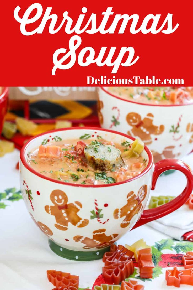 two christmas soups in red and white mugs with ginger candies on the side