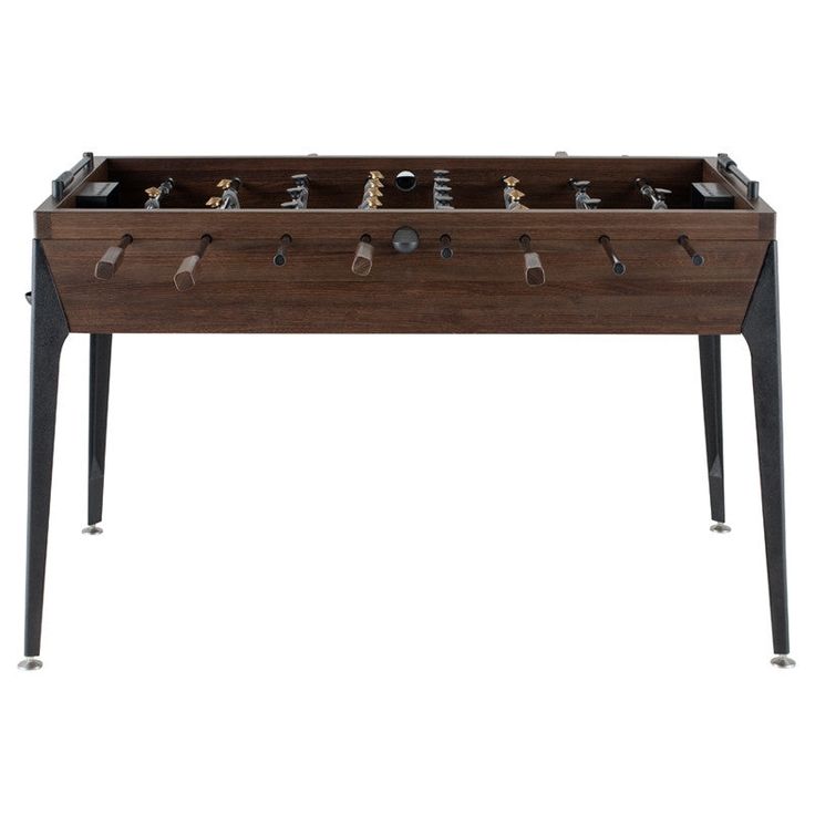 an old school foosball table with metal legs