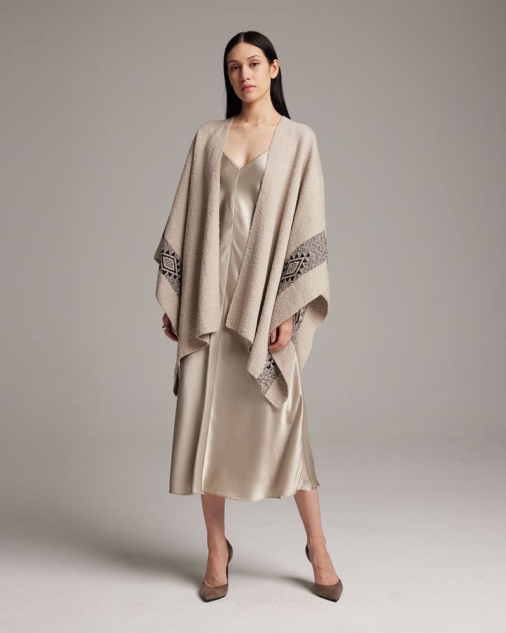 Hand-loomed long dramatic ruana, or poncho, features the Estrella symbol which represents divine femininity. 100% Organic Pima Cotton Size OS Handmade in Southern Chile by Mapuche Artisans Product Care: Dry Clean Only or Delicate Hand Wash Elegant Oversized Cape Poncho, Elegant Oversized Poncho Cape, Elegant Evening Poncho For Fall, Elegant Beige Cape Poncho, Elegant Oversized Cape Shawl, Elegant Oversized Shawl Cape, Elegant Beige Poncho, Elegant Shawl Cape For Fall, Cotton Kaftan