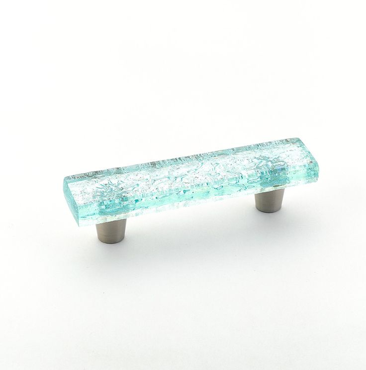 a glass drawer handle on a white background