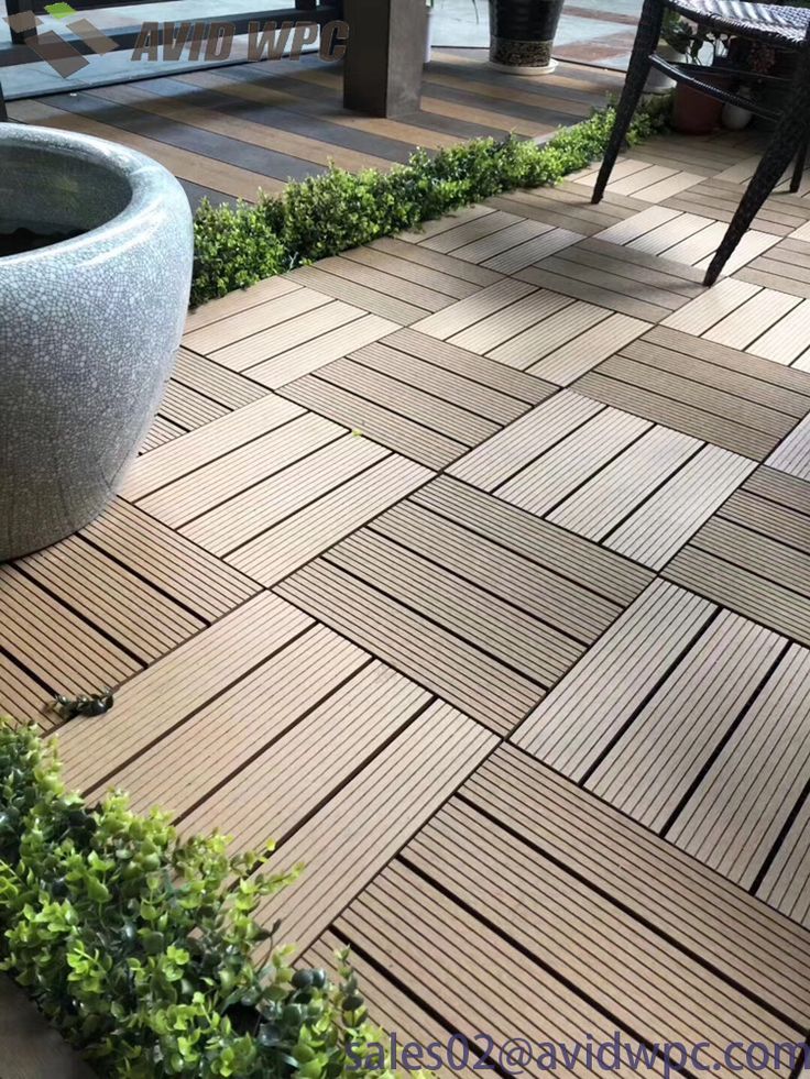 a planter sitting on top of a wooden floor next to a table and chairs