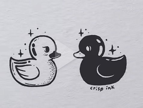 two rubber ducks are next to each other on a paper sheet that says crisp ink