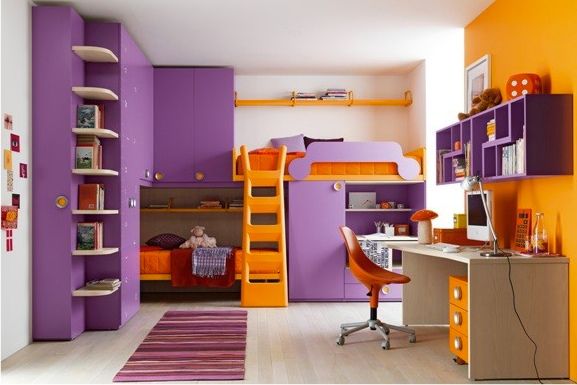 a bedroom with purple and orange bunk beds, desks and chairs in it's room