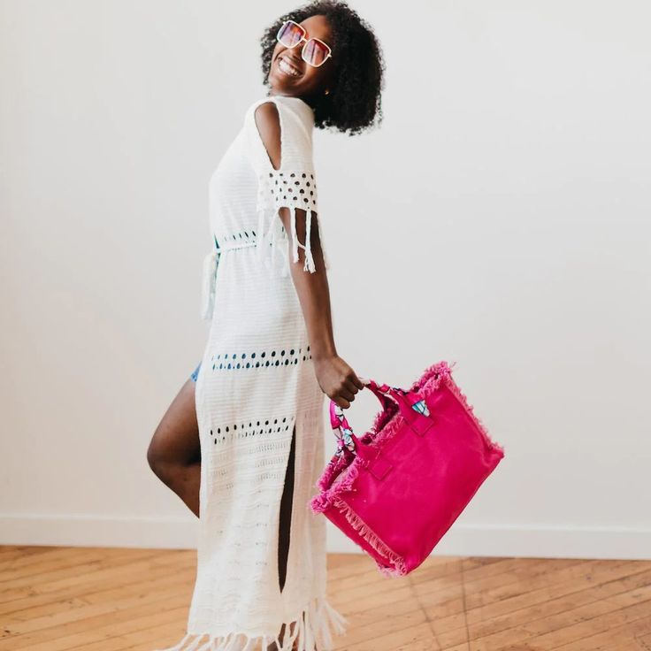 This is the perfect tote for the summer. It holds all your items for a day out on the town, running errands, to the office, gym, the beach, and more! The details in this bag are what make it so special and unique. This tote features hand-made fringe edges, a top zipper closure, an interior zipper pocket, and a coordinating scarf wrapped around the handle of the bag. The Chloe Canvas Fringe Tote also comes with a removable and adjustable strap, allowing you to style it as a crossbody bag. The han Chic Beach Bag For Day Out, Large Capacity Beach Bag For Summer Day Out, Chic Shoulder Bag For Vacation Travel, Summer Day Out Bag With Double Handle, Chic Shoulder Bag For Travel And Vacation, Trendy Beach Bag With Double Handle For Day Out, Trendy Double Handle Beach Bag For Day Out, Spring Beach Bag With Large Capacity For Day Out, Summer Tote Shoulder Bag For Day Out