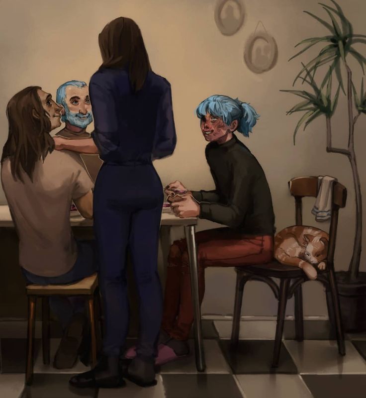 three people sitting at a table in front of a cat and another person with blue hair