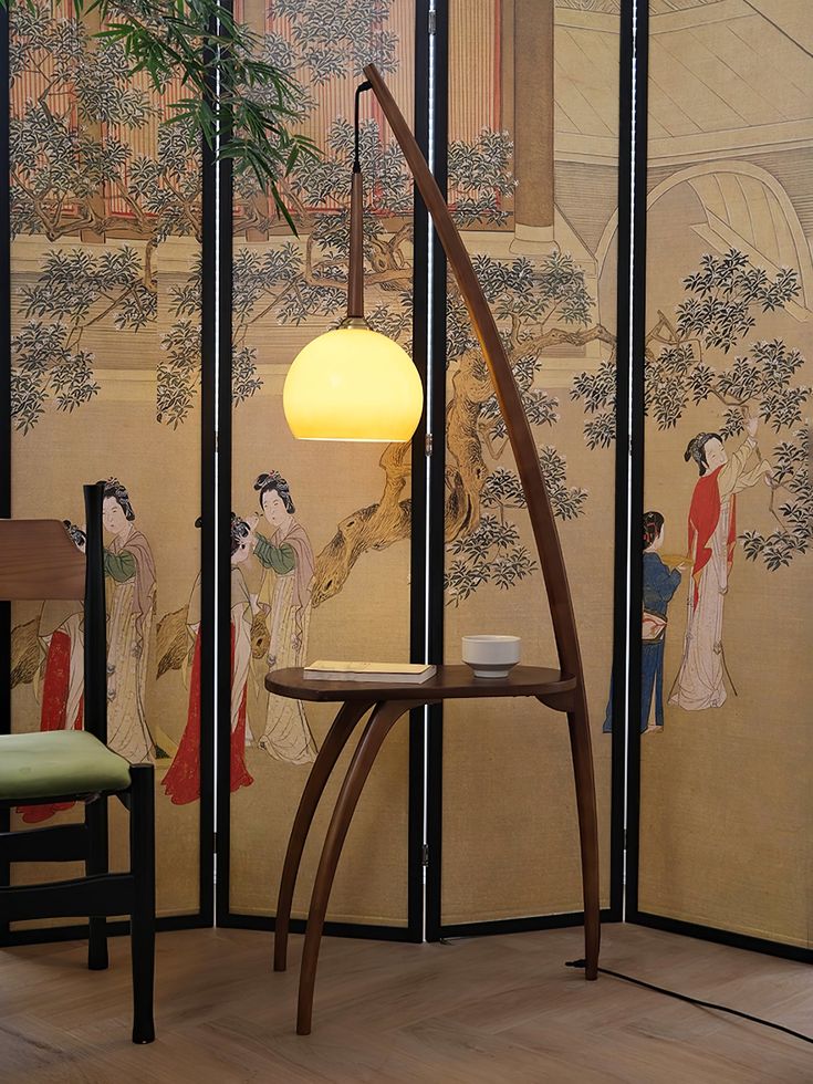 The Arc Sphere Floor Lamp by Vakkerlight is an extraordinary blend of art and function, designed to elevate any living space with its sleek, sculptural form. The elegantly curved wooden arc creates a striking silhouette, while the suspended amber glass globe provides a warm, ambient glow. More than just a light source, this floor lamp also features a built-in table, making it a practical yet stylish addition to your home. Perfect for modern or contemporary interiors, the Arc Sphere Floor Lamp br Eccentric Floor Lamp, Sphere Floor Lamp, Art Nouveau Furniture Lamps, Floor Lamp Stained Glass, Art Nouveau Floor Lamp, 70’s Floor Lamp, Rope Lamp, Art Deco Lamp, Table Making