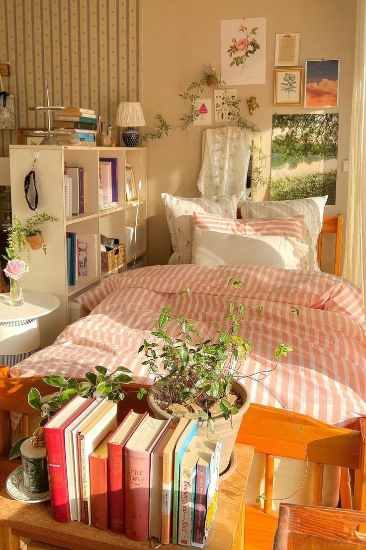 a bed room with a neatly made bed and lots of books