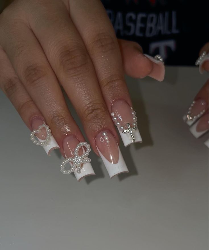 Pearl And Diamond Acrylic Nails, Pearl Charms Nails, Long Nails With Pearls, White Prom Nails Acrylic Short, Birthday Nails Pearls, Decorated French Tip Nails, White French Nails With Charms, Birthday Short Nail Set Ideas, Acrylic Nails With Pearl Stones