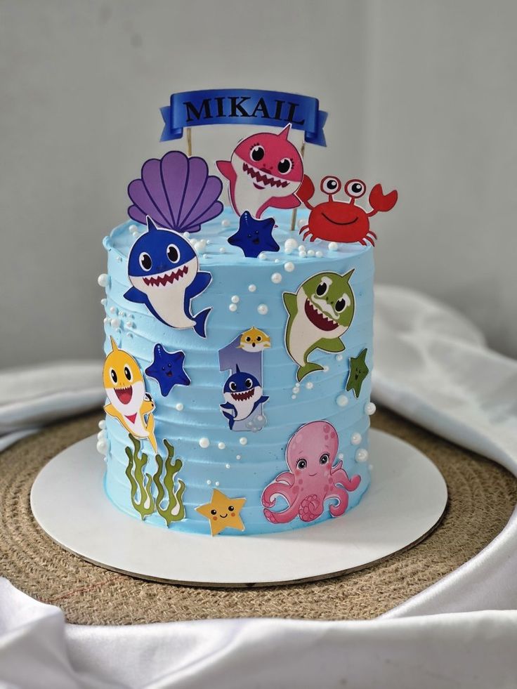 there is a blue cake decorated with sea animals