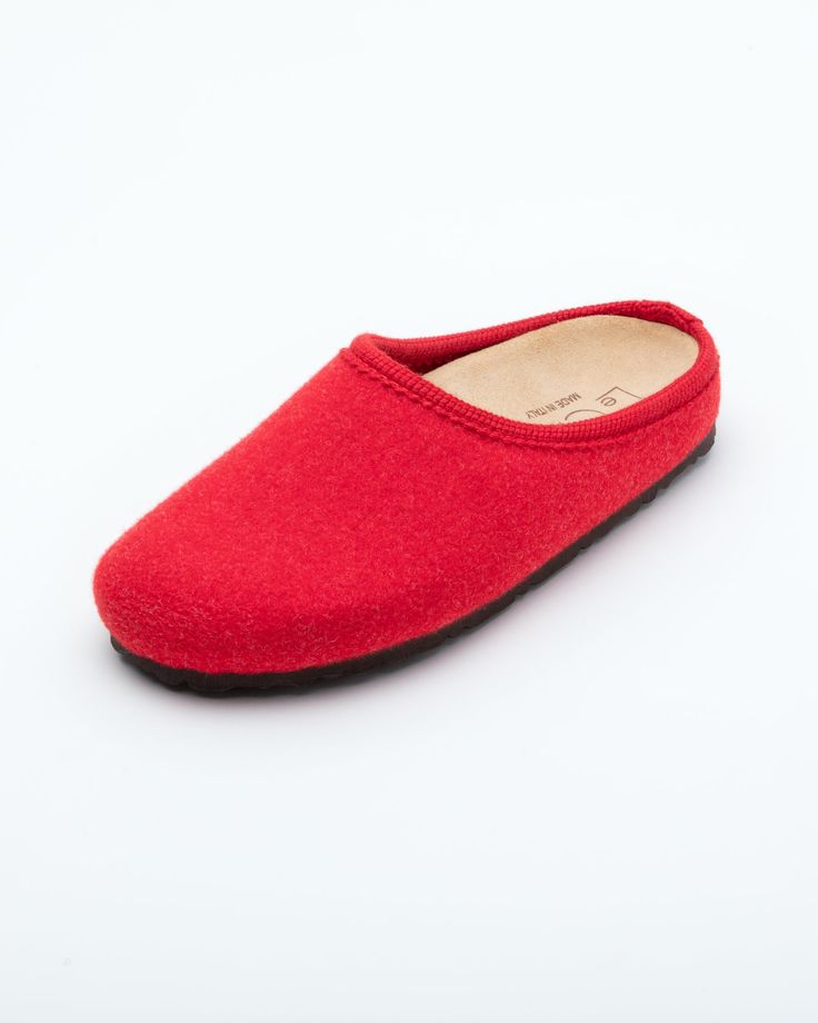 Description: The Nebraska Women's Wool Clog is an Italian take on a European classic. The women's Nebraska in red is one of the most versatile mule style slippers available. From home to the office to weekend, the minimalist design of these clogs will take you anywhere in comfort. The anatomical self-molding latex and thermoforming cork insole provide a firm customized comfort, and the insole is completely removable. LeClare Slippers are exclusively handcrafted in our small-batch factory in Trev Solid Color Slip-on Clogs With Rubber Sole, Comfortable Red Slippers With Rubber Sole, Indoor Closed Toe Clogs With Cushioned Footbed, Red Leather Sole Slip-on Slippers, Red Slip-on Slippers With Leather Sole, Red Flat Slippers With Cushioned Footbed, Red Cushioned Flat Slippers, Red Slip-on Slippers With Rubber Sole, Slip-on Indoor Clogs