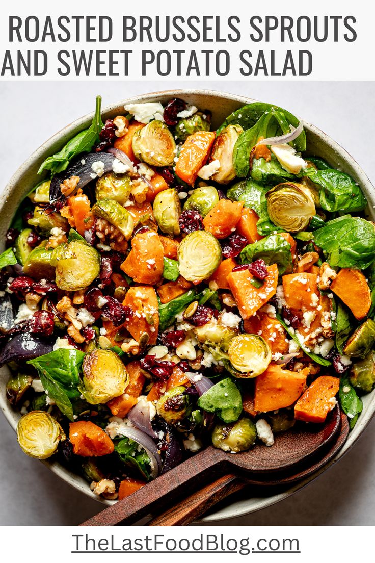 roasted brussel sprouts and sweet potato salad in a bowl with a wooden spoon