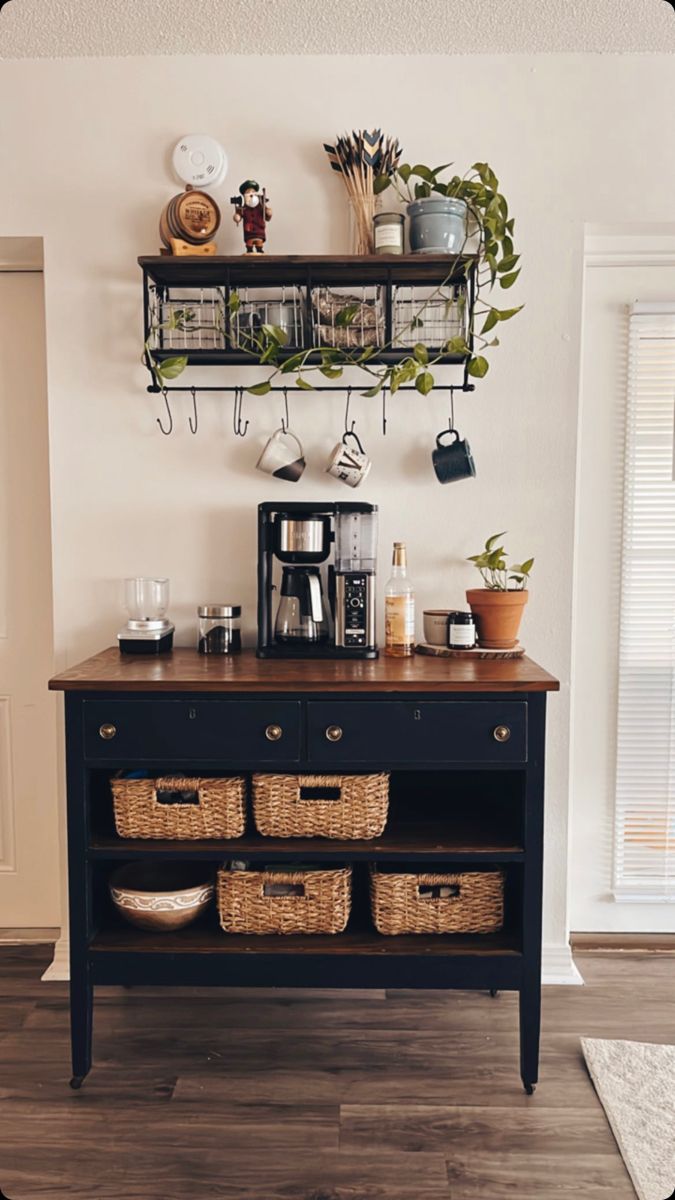 a coffee bar with baskets on the top and shelves above it that are filled with plants