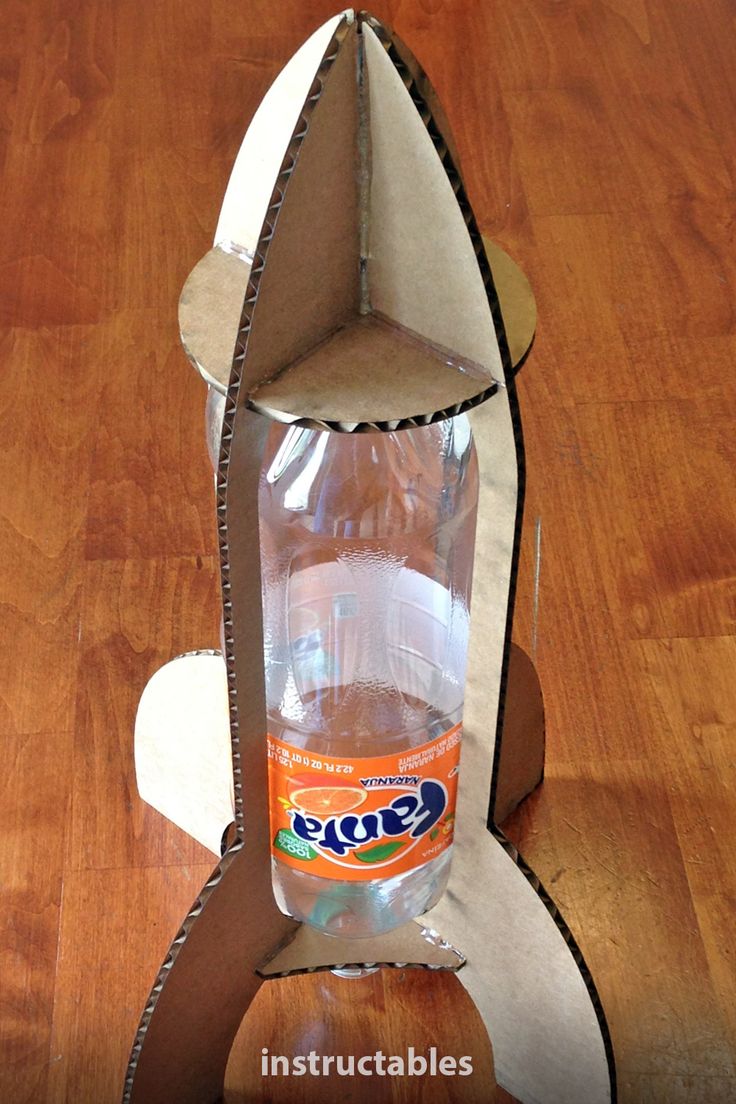 an open cardboard rocket ship with water in it