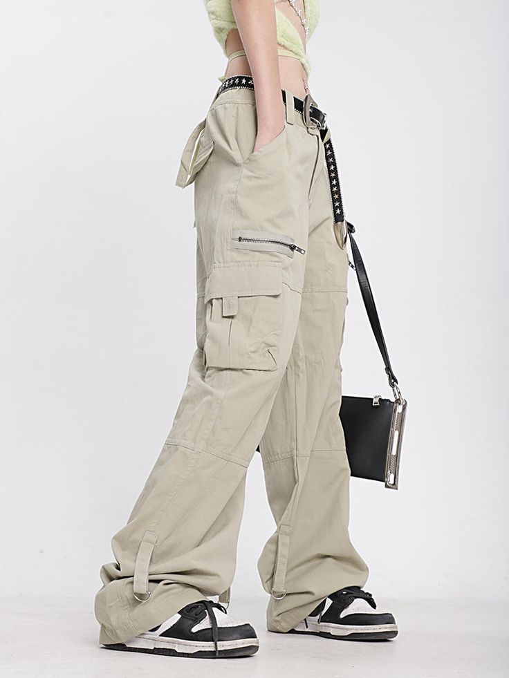 Make your wardrobe work for you - these khaki cargo pants are the perfect combination of style and functionality. With plenty of space for all your bits and bobs, you'll stay organized and lookin' sharp! Model is 5'3 100lbs wearing M Techwear Khaki Pants With Hip Pockets, Baggy Combat Cargo Pants In Khaki, Trendy Full-length Khaki Cargo Pants, Khaki Combat Bottoms With Multiple Pockets, Trendy Full Length Khaki Cargo Pants, Techwear Khaki Pants With Side Pockets, Combat Style Cargo Pants With Multiple Pockets, Full Length Combat Cargo Pants, Combat Style Full-length Cargo Pants