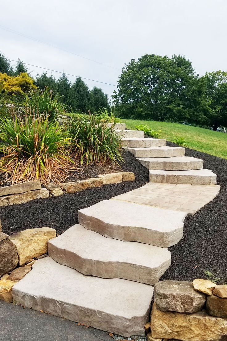 stone steps leading up to the top of a hill