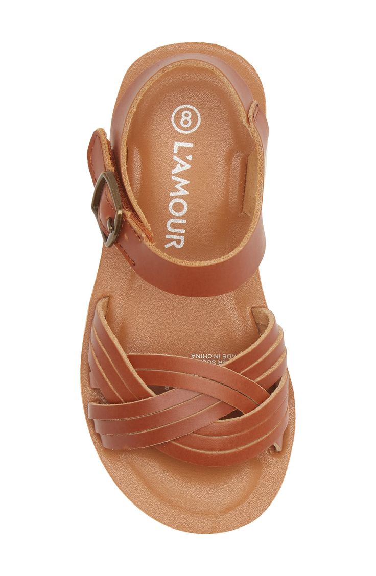 Memory foam cushioning brings comfort with every step they take in this go-anywhere leather sandal shaped with wavy woven straps. Leather upper/synthetic lining and sole Imported Casual Sandals With Woven Leather And Adjustable Fit, Casual Sandals With Adjustable Woven Leather, Casual Adjustable Woven Leather Sandals, Adjustable Woven Leather Closed Toe Sandals, Casual Brown Woven Leather Sandals, Adjustable Leather Sandals With Woven Sole, Comfortable Brown Woven Leather Sandals, Adjustable Brown Synthetic Sandals, Synthetic Closed Toe Woven Leather Sandals